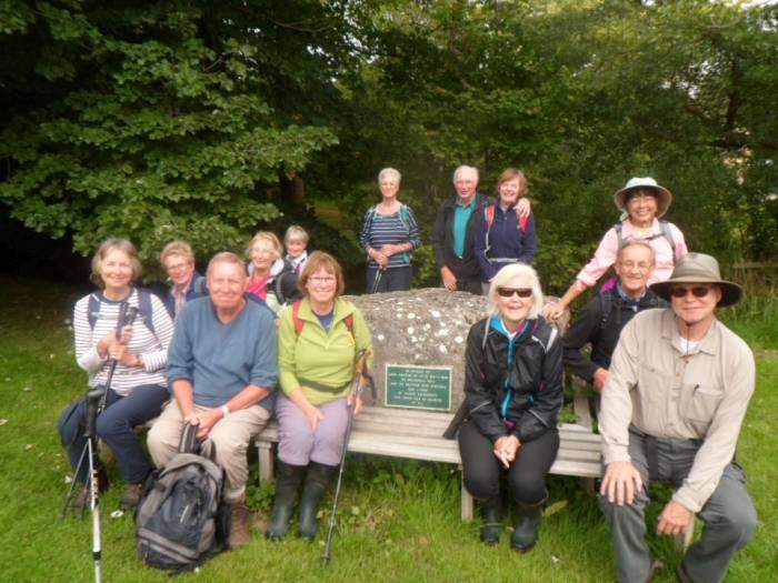 But pose for a group photo by the river