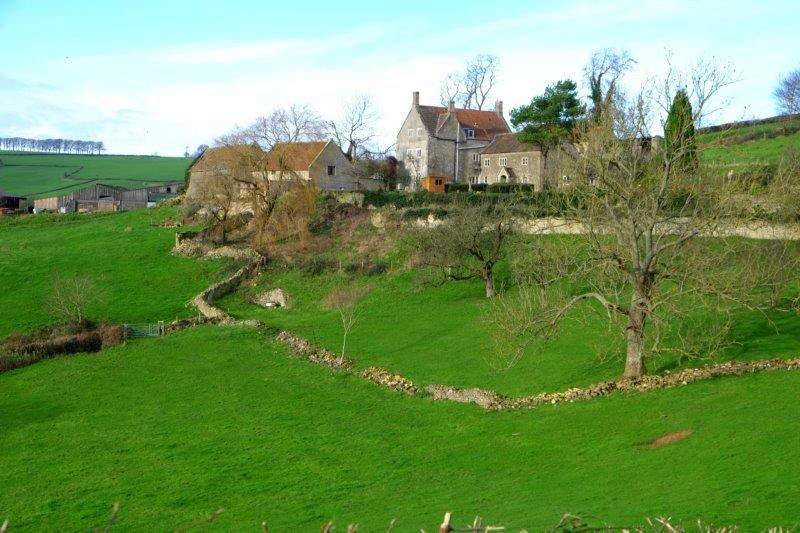 Past a large farmhouse