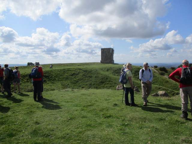 At the iron age hill fort, the stone tower now supporting telecommunications equipment