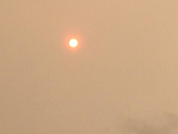 Red sun phenomenon casts a ghostly haze