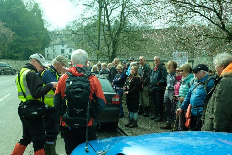 Crowding on the roadside in Avening ready to start the walk in memory of  Denys