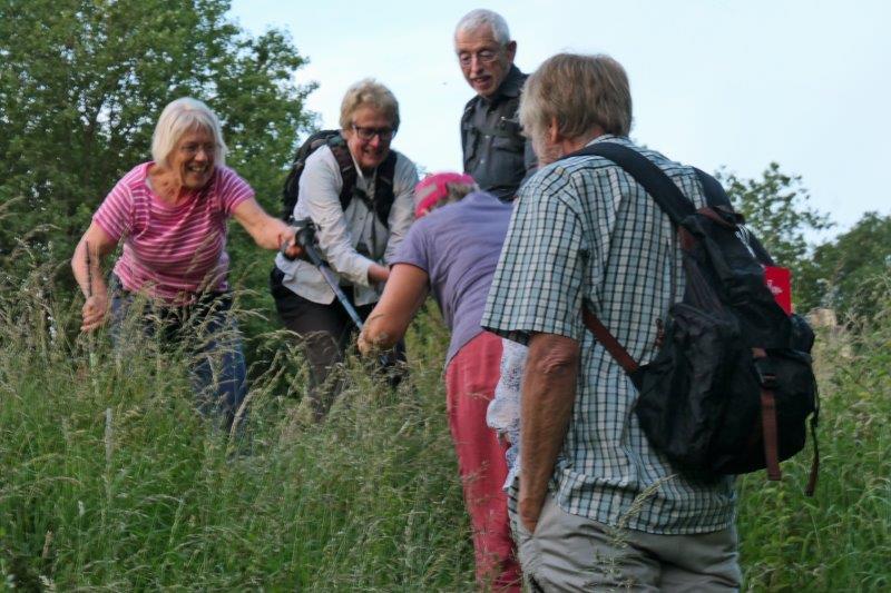 A helping hand needed on the steep slope as we head back to the start