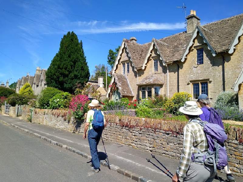 A sunny Monday morning. Four of us walk through the rebuilt village.