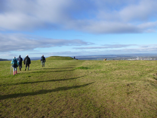 Brian leads us in the sun across the common, where you can see the River Severn in the distance