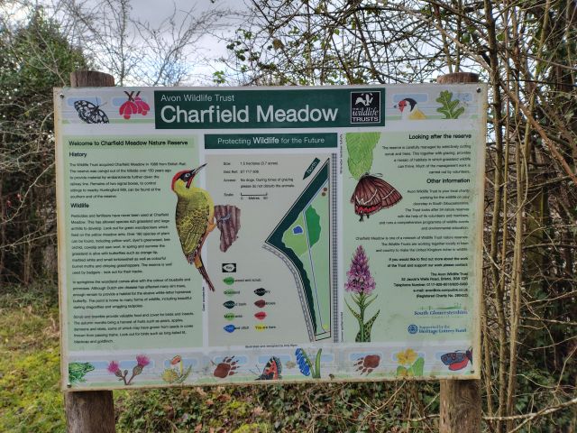 Signboard displaying Charfield Meadow wildlife information.