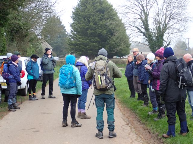 Group of hikers gathered on a rural path