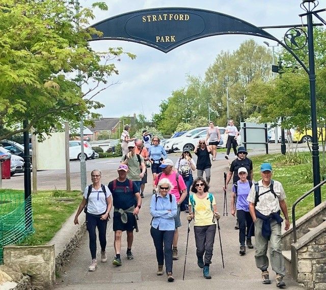Walkers with poles entering Stratford Park